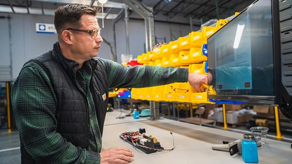 Operators interact with PICO visual worker guidance on the shop floor